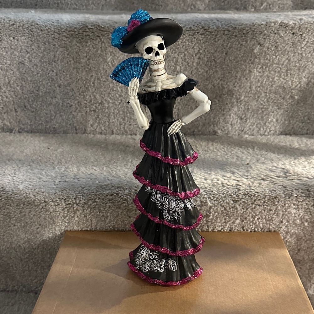 Skeleton Figurine with Fan